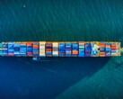 An aerial image of a container ship (Image source: Venti Views via Unsplash; cropped)