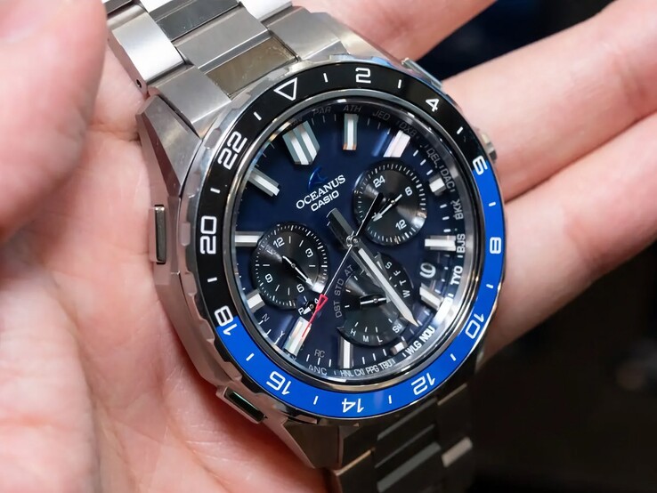 Close-up of the Casio Oceanus OCW-P3000 blue dial showing city codes, subdials, luminous hour markers, and broad hands.