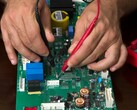 Technician testing electronic hardware, similar to the process used for PQShield's post-quantum cryptography chip (Image source: Pexels)