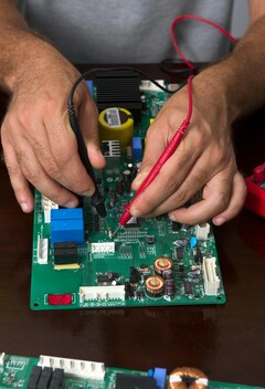 Technician testing electronic hardware, similar to the process used for PQShield's post-quantum cryptography chip (Image source: Pexels)