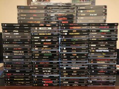 A collection of PlayStation 1 physical discs including boxes