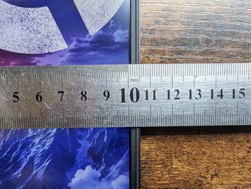 Narrow side bezels with thicker top and bottom bezels