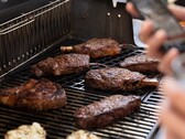 The Genesis smart grill will help you cook, with the ability to notify you via an app when your food is ready to serve. (Image source: Weber)