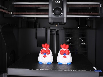 Multicolor 3D prints of a chickens inside the Centauri Carbon 2 Combo. (Image source: Elegoo)