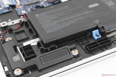 Down-firing stereo speakers near front corners of the chassis