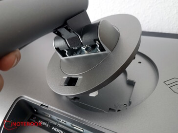 The dark slide switch at the bottom secures the stand inside