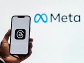 Meta, logo of which is pictured in the background, has started an acquisition spree of AI startups. (Image Source: Julio Lopez - Pexels)