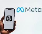 Meta, logo of which is pictured in the background, has started an acquisition spree of AI startups. (Image Source: Julio Lopez - Pexels)