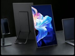 The external monitor can be positioned in multiple ways on a desk.