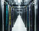 Rows of Meta data centre server racks with colour-coded cabling and overhead power systems inside a high-density compute hall. (Image Source: Meta)