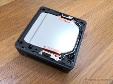 The top plastic plate can be easily removed. However, additional disassembly is required to access the internal fan