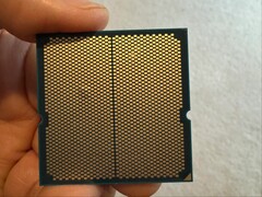 A user has shared images of a bulge in their Ryzen 9 9950X3D CPU which was paired with an ASRock motherboard. (Image source: I_fliu on Reddit)