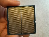 A user has shared images of a bulge in their Ryzen 9 9950X3D CPU which was paired with an ASRock motherboard. (Image source: I_fliu on Reddit)