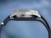 Side profile of the Peanuts x Timex Marlin Jet Automatic showing the stainless steel case, domed Hesalite crystal covering the bezel, and blue textured fabric strap.