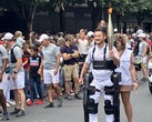 Paralyzed Kevin Piette walks with Olympics 2024 torch while wearing Wandercraft Atalante X exoskeleton. (Image source: Jean Louis Constanza, Wandercraft) 