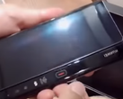 The revised Huawei Mate X has a red button for unfolding the device. (Image source: YouTube)