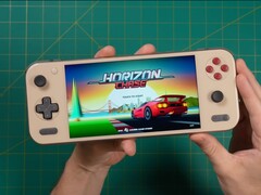 Russ from Retro Game Corps holds the Ayaneo Pocket S2, displaying the title screen of Horizon Chase and showcasing the device’s display and ergonomic design. (Image source: Retro Game Corps)