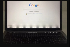 MacBook Pro with a broken flex cable showing