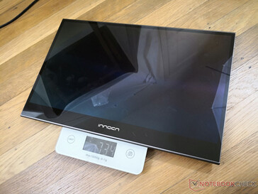 Monitor weighs 734 g or 1192 g with the removable folio cover on