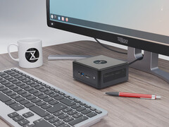 The Nano Pro Gen 14 starts at €840. Pictured: the mini PC next to a monitor, keyboard, teacup, pen. (Image source: Tuxedo)