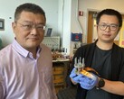 Hailong Chen and Zhantao Liu present a new, low-cost cathode for all-solid-state lithium-ion batteries. (Image source: Jerry Grillo / Nature Sustainability / Georgia Institute of Technology)
