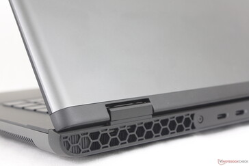 Anodized aluminum outer lid and bottom cover contrast the darker keyboard deck