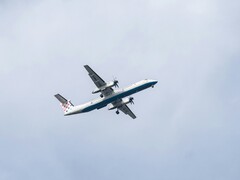An airplane flying in the sky (Image source: Kat von Wood via Unsplash; cropped)
