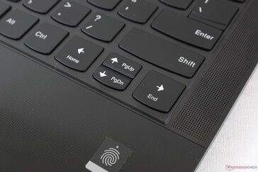 Fingerprint reader and speaker grilles along the edges of the keyboard