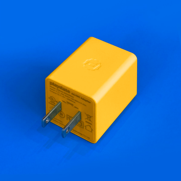 The Playdate AC charger has an American plug but it's neither foldable nor retractable. (Image source: Panic)