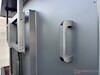 Two handles on the back make installation easier.