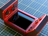 It is unclear who has created this strange clamshell gaming handheld. (Image source: via Nittrx)