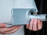 The Vivo X Fold 6, pictured here with its Zeiss teleconverter, will be available in four color options. It underwent durability testing in a new promo video.