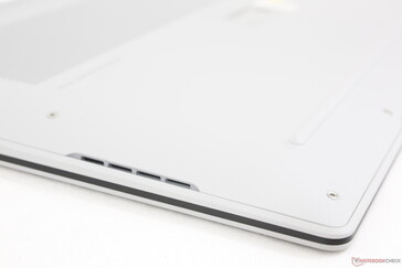 Rounded edges and corners with down-firing speaker grilles