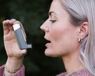A person holding an inhaler (Image source: CNordic Nordic via Unsplash; cropped)