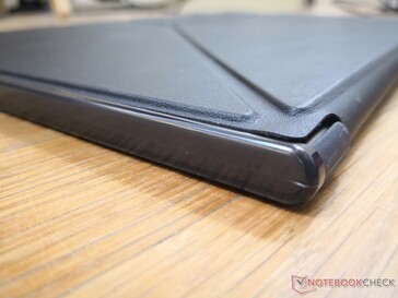 The removable folio is faux leather with a polythene-plastic-like protection around the edges, corners, and back of the monitor