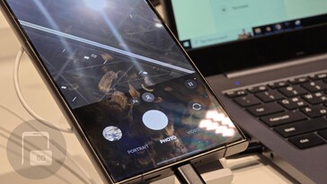 Samsung hides the settings found at the top of the camera app behind a new button.
