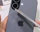 Back of the iPhone 17 being permanently scratched with aluminum. (Image source: JerryRigEverything on YouTube, screenshot)
