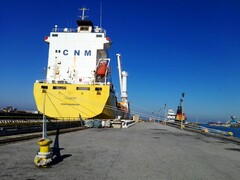 A moored container ship at a quay (Image source: Bruno Hervas via Unsplash)