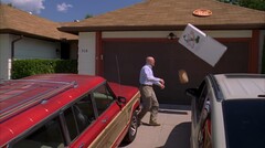 Bryan Cranston throwing a pizza on a roof (image source: Breaking Bad)