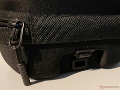 The carrying bag features a lockable grommet for routing a charging cable
