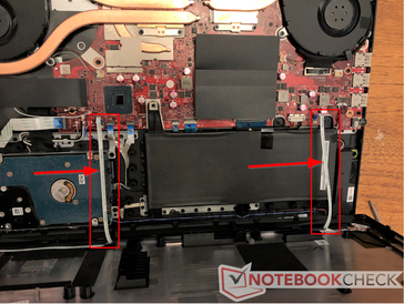 Take care when opening the laptop; two thin ribbon cables are glued to the bottom panel.