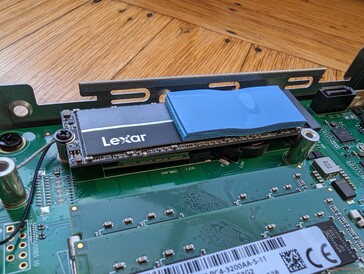 SATA III caddy removed. M.2 SSD comes with a heat pad to dissipate heat onto the SATA III caddy