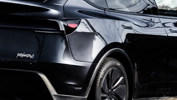 The Tesla Robotaxi platform logo on the rear bumper.