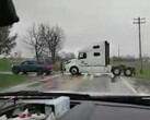 The helpful driver of a Rivian R1T in Illinois had no issues pulling a heavy semi truck back on the road (Image: NotNearlyNormal)