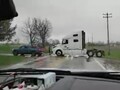 The helpful driver of a Rivian R1T in Illinois had no issues pulling a heavy semi truck back on the road (Image: NotNearlyNormal)