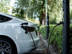 An electric car plugged in (Image source: Emma Smith via Unsplash; cropped)
