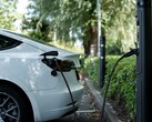 An electric car plugged in (Image source: Emma Smith via Unsplash; cropped)