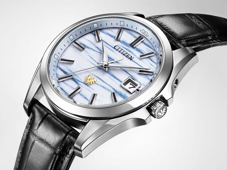 Angled close-up of the Citizen AQ4090-08A showcasing its indigo washi paper dial, silver-tone hands, date window, and polished titanium case.