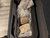 Asus TUF RTX 5080 GPU box with rocks inside. (Image source: GnarDead on Reddit)