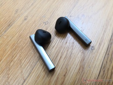 Earbuds are longer and thinner than most others. The right earbud has an integrated microphone